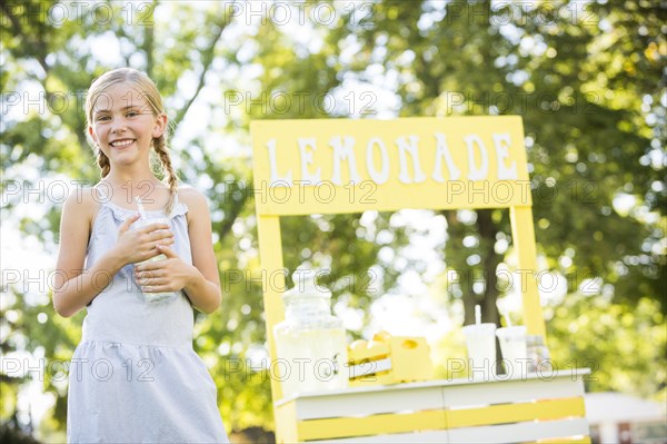 Caucasian girl smiling at lemonade stand