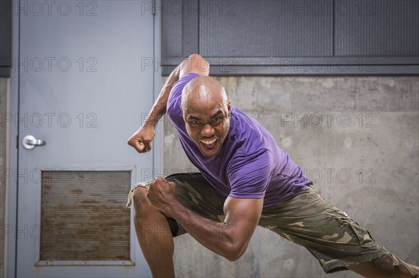 Black dancer crouching