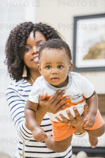 Close up of Black mother holding baby son