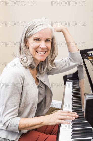 Caucasian woman playing piano