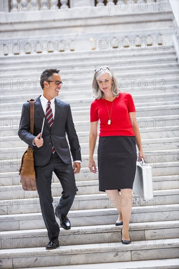 Business people talking on steps