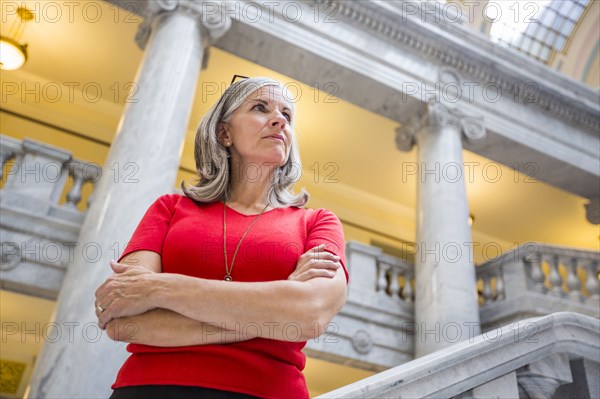 Caucasian businesswoman standing in courthouse