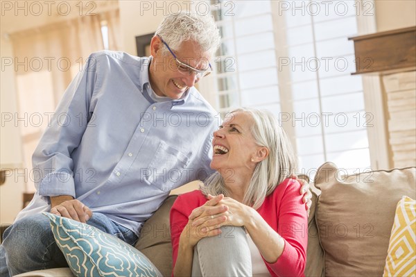 Caucasian couple sitting on sofa