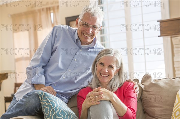 Caucasian couple sitting on sofa
