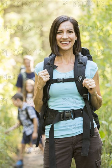 Caucasian family hiking on path