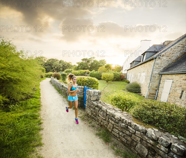 Caucasian woman jogging outdoors