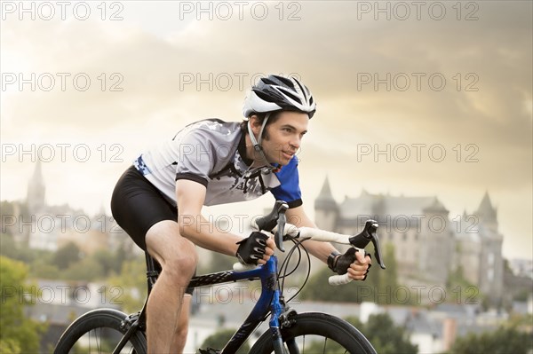 Caucasian man cycling outdoors