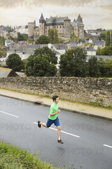 Caucasian man running outdoors