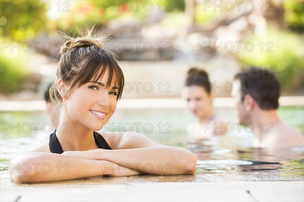 Woman smiling in swimming pool