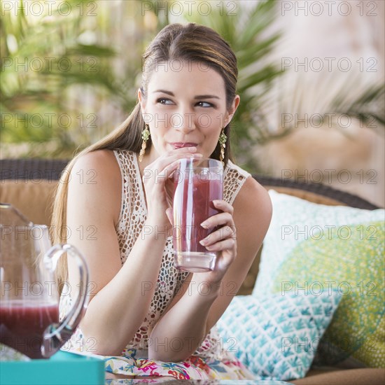 Caucasian woman drinking juice