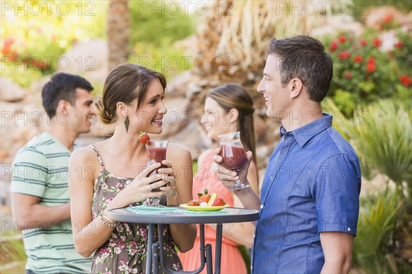 Couple having cocktail at outdoor patio