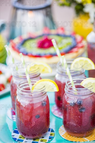 Fruit juice in jars outdoors