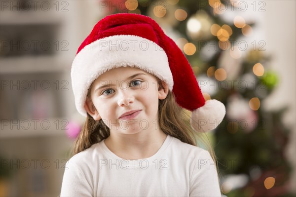 Caucasian girl wearing Santa hat