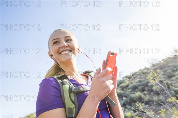 Caucasian woman using cell phone outdoors