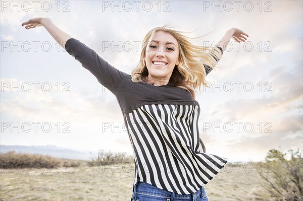 Caucasian teenage girl cheering