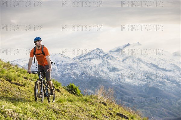 Caucasian man riding mountain bike