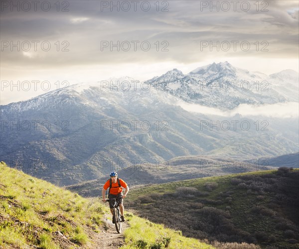 Caucasian man riding mountain bike