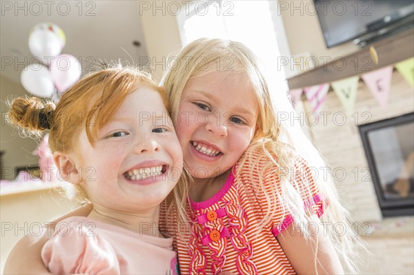 Caucasian girls smiling cheek to cheek
