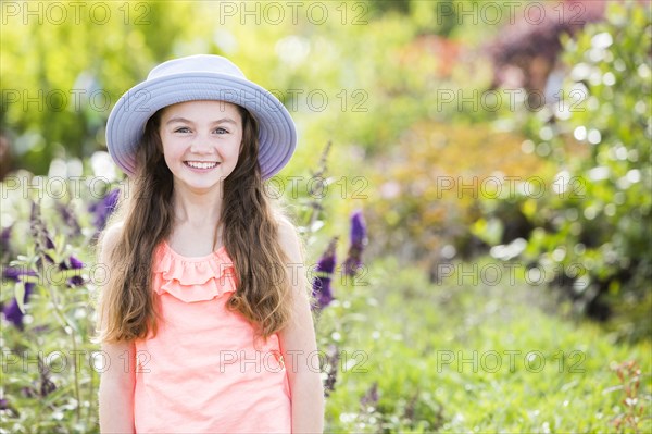 Caucasian girl posing in garden
