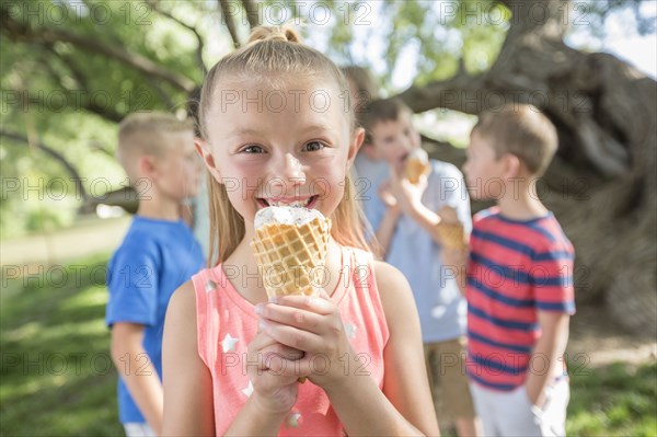 Caucasian girl eating ice cream cone