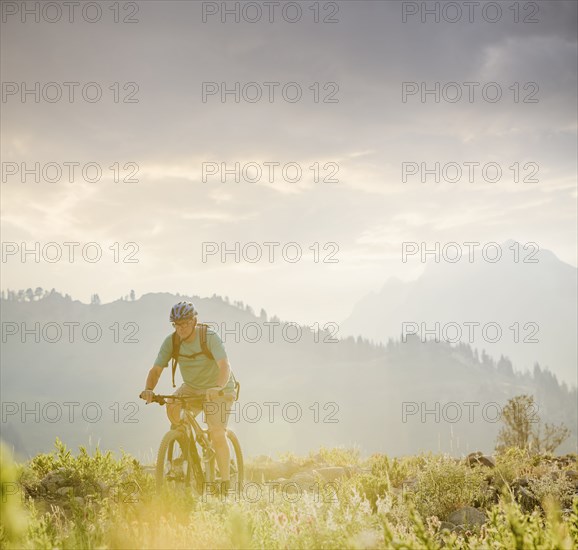 Caucasian man riding mountain bike