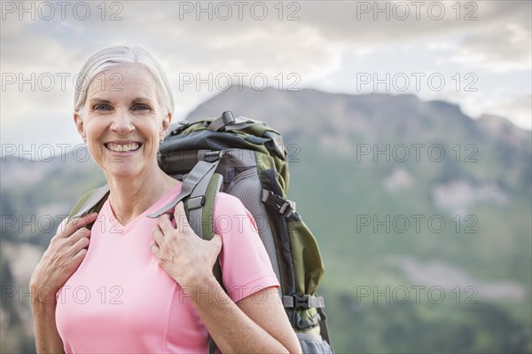 Caucasian woman hiking on mountain