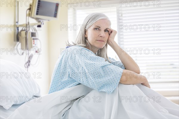 Portrait of frustrated Caucasian woman in hospital bed