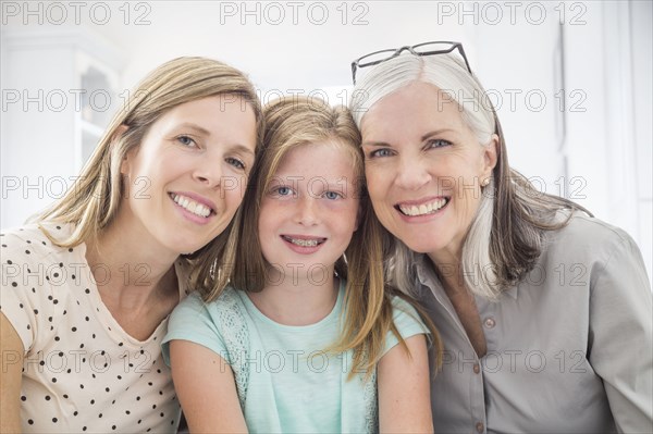 Portrait of women and girl smiling cheek to cheek