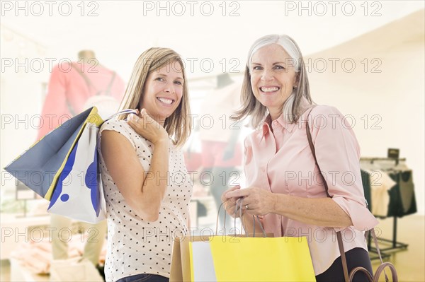 Portrait of Caucasian women holding shopping bags