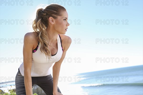 Caucasian woman resting at beach