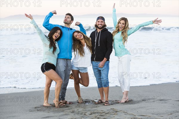 Carefree friends posing at beach