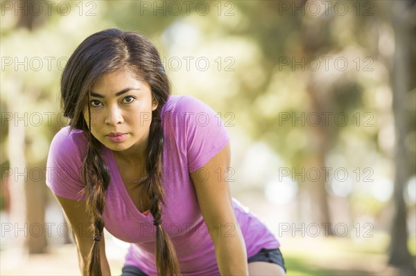 Asian woman resting outdoors