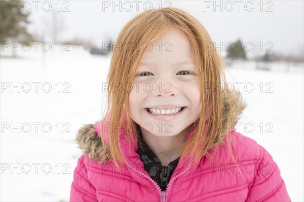 Portrait of smiling girl in winter