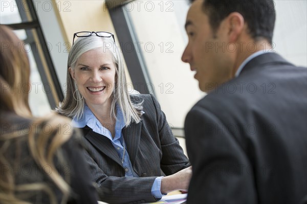 Portrait of smiling businesswoman in meeting