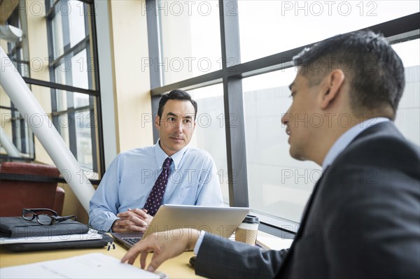 Businessmen talking in meeting