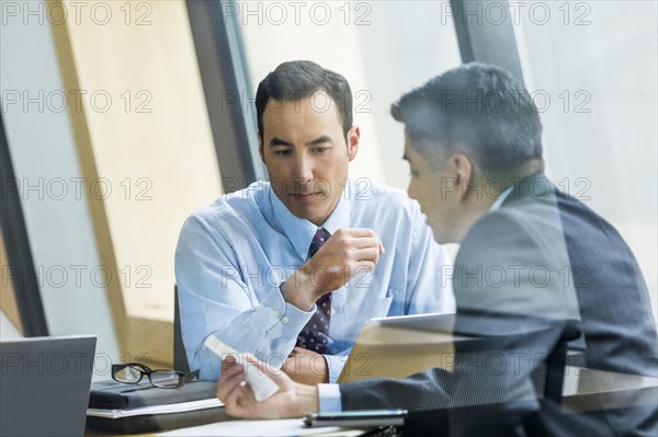 Businessmen talking in meeting