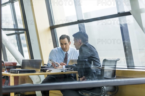 Businessmen talking in meeting