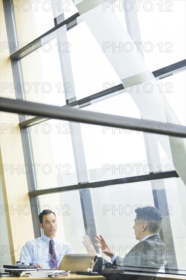 Businessmen talking in meeting