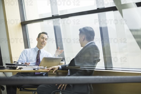 Businessmen talking in meeting