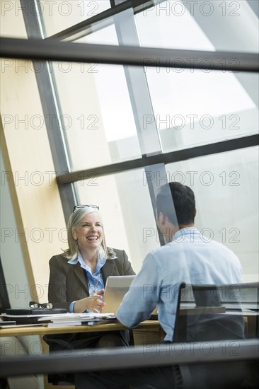 Business people smiling in meeting