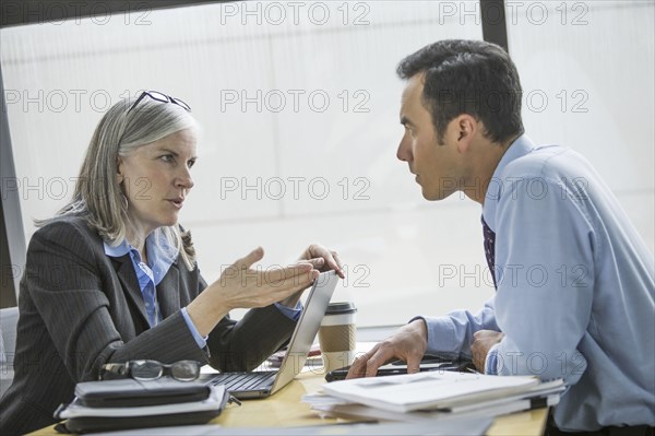 Business people talking in meeting