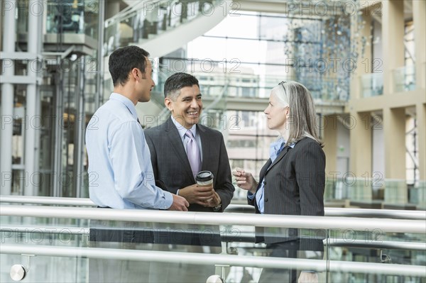 Business people talking in lobby