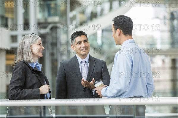 Business people talking in lobby