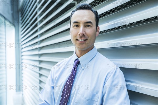 Portrait of smiling Mixed Race businessman