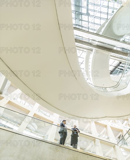 Business people talking in lobby