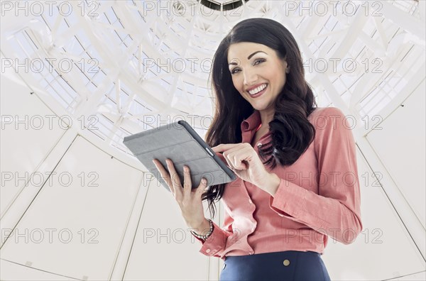 Caucasian businesswoman using digital tablet