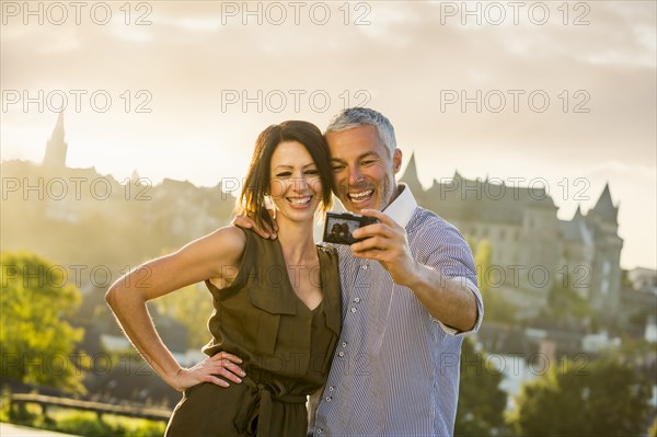 Caucasian couple posing for selfie