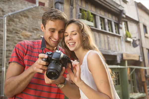 Caucasian couple examining the camera