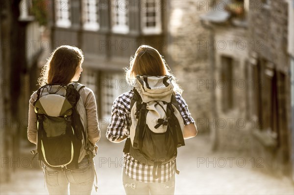 Caucasian women backpacking in city