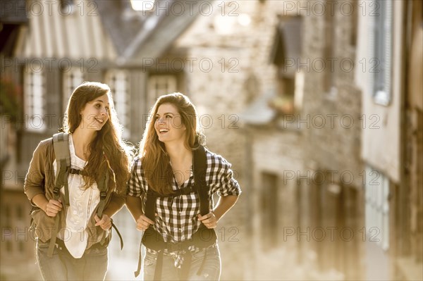 Caucasian women backpacking in city